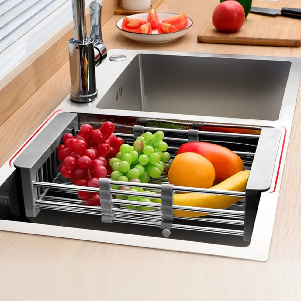 Stainless steel expandable drain basket above sink – functional kitchen accessory