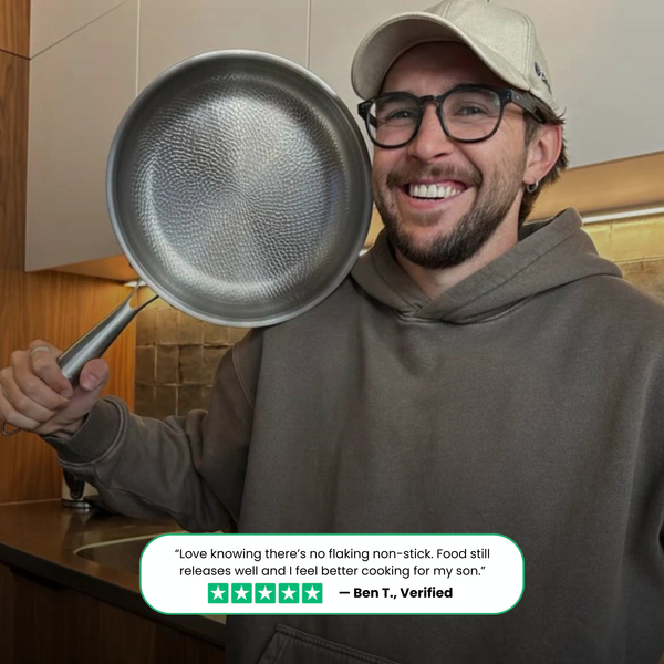 T7 Pro easy-clean pan rinsing under tap showing non-stick surface