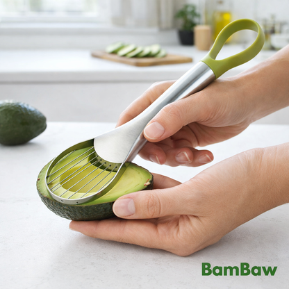 Hands slicing an avocado with the BamBaw stainless steel 2-in-1 avocado slicer in a modern kitchen